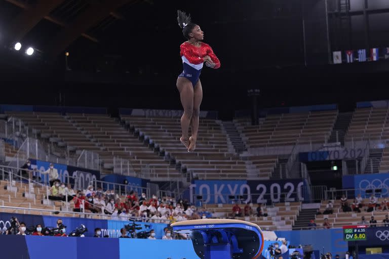 Simone Biles, of the United States, performs on the vault during the artistic gymnastics women's final at the 2020 Summer Olympics, Tuesday, July 27, 2021, in Tokyo. (AP Photo/Gregory Bull)