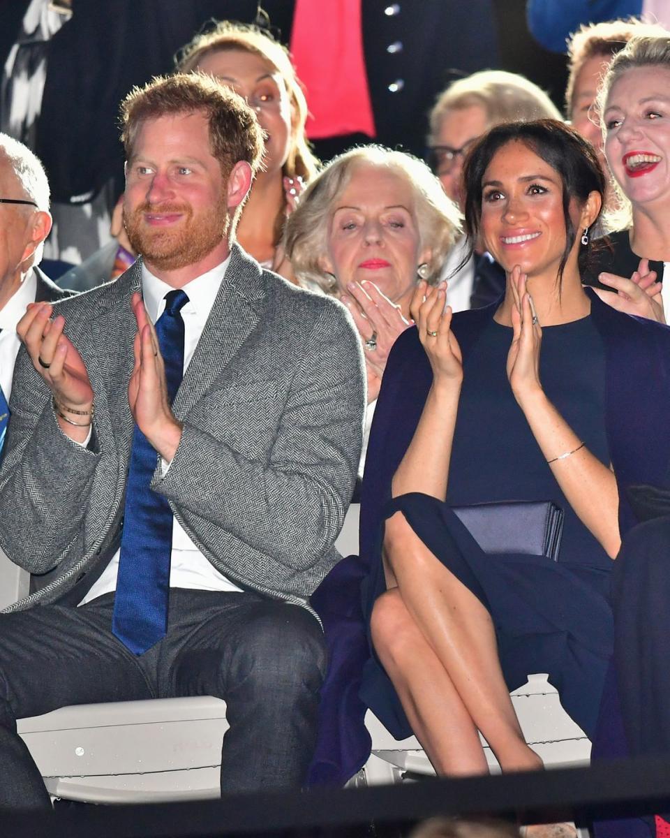 <p>The Duke and Duchess applaud the successful opening ceremony.</p>