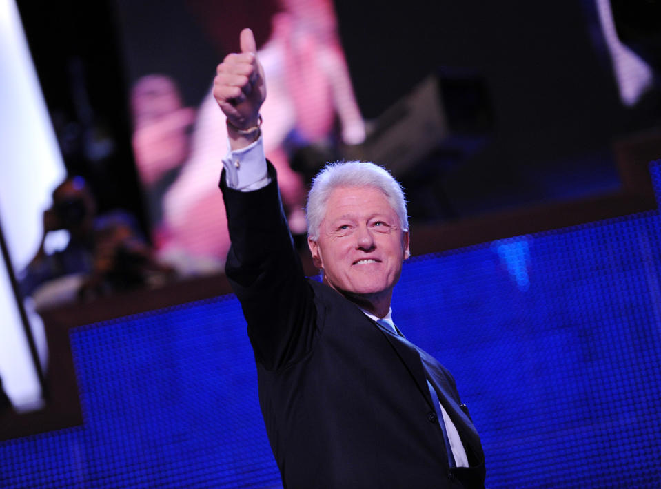 Former President Bill Clinton flashes a thumbs up following