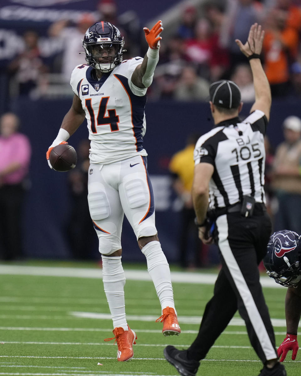 Denver Broncos wide receiver Courtland Sutton (14) signals a first down after making a catch against the Houston Texans in the second half of an NFL football game Sunday, Dec. 3, 2023, in Houston. (AP Photo/Eric Christian Smith)
