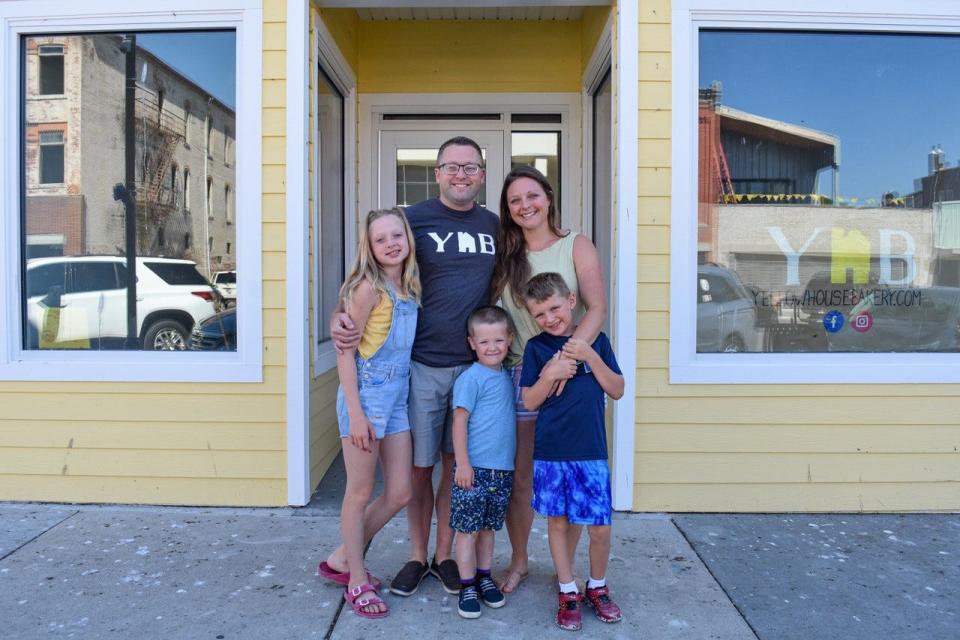 Drew and Jen Gatliff stand with their children, left to right, Asa, Hayden and Oakley, outside the Yellow House Bakery in downtown Port Clinton. The community, excited about the bakery’s opening, funded over 30% of a crowdsourcing campaign in the first few days after it launched. The campaign continues until mid-July.