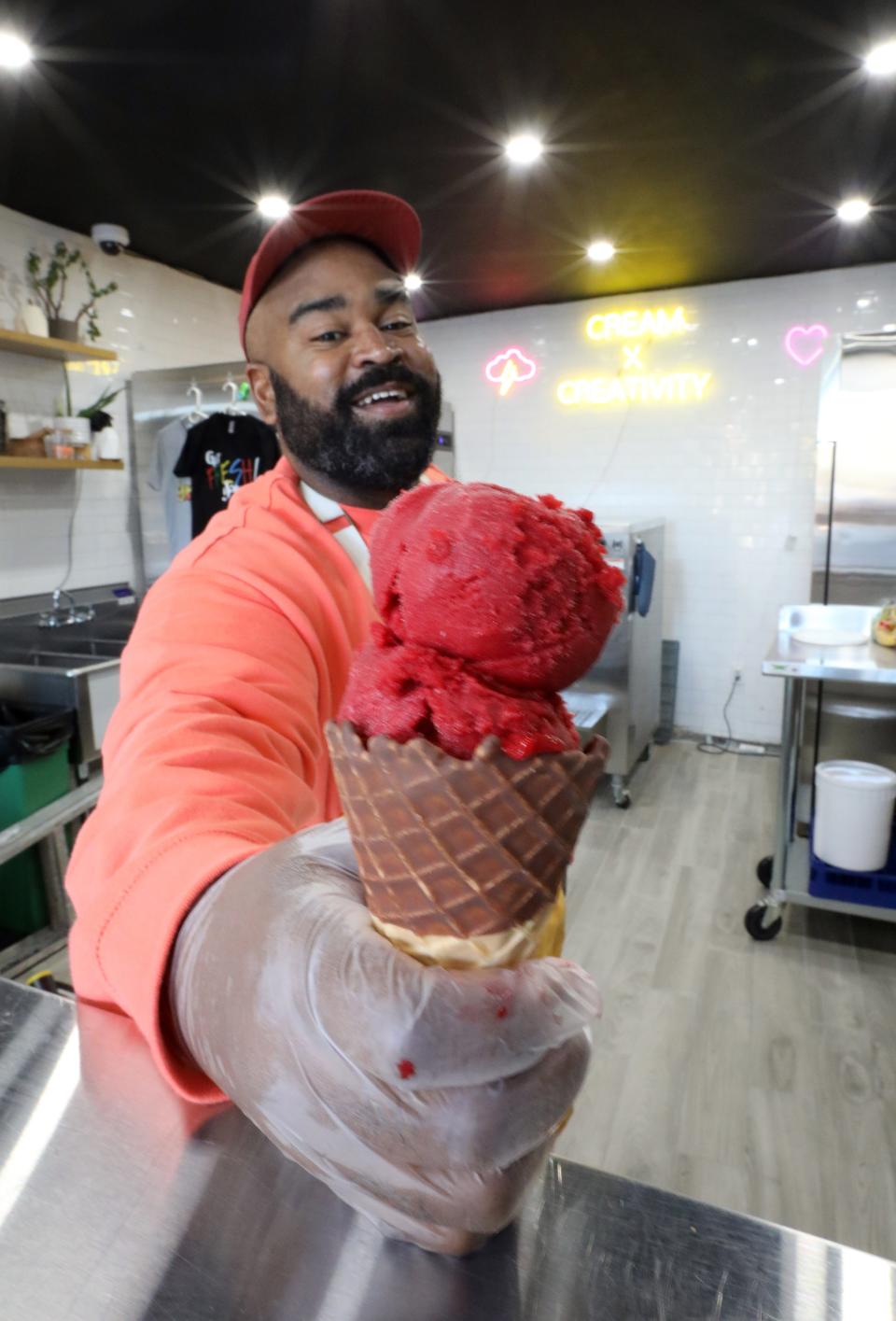 Patrick Cruz with a raspberry sorbet cone at Lost Borough Ice Cream in Yonkers Nov. 10, 2021.