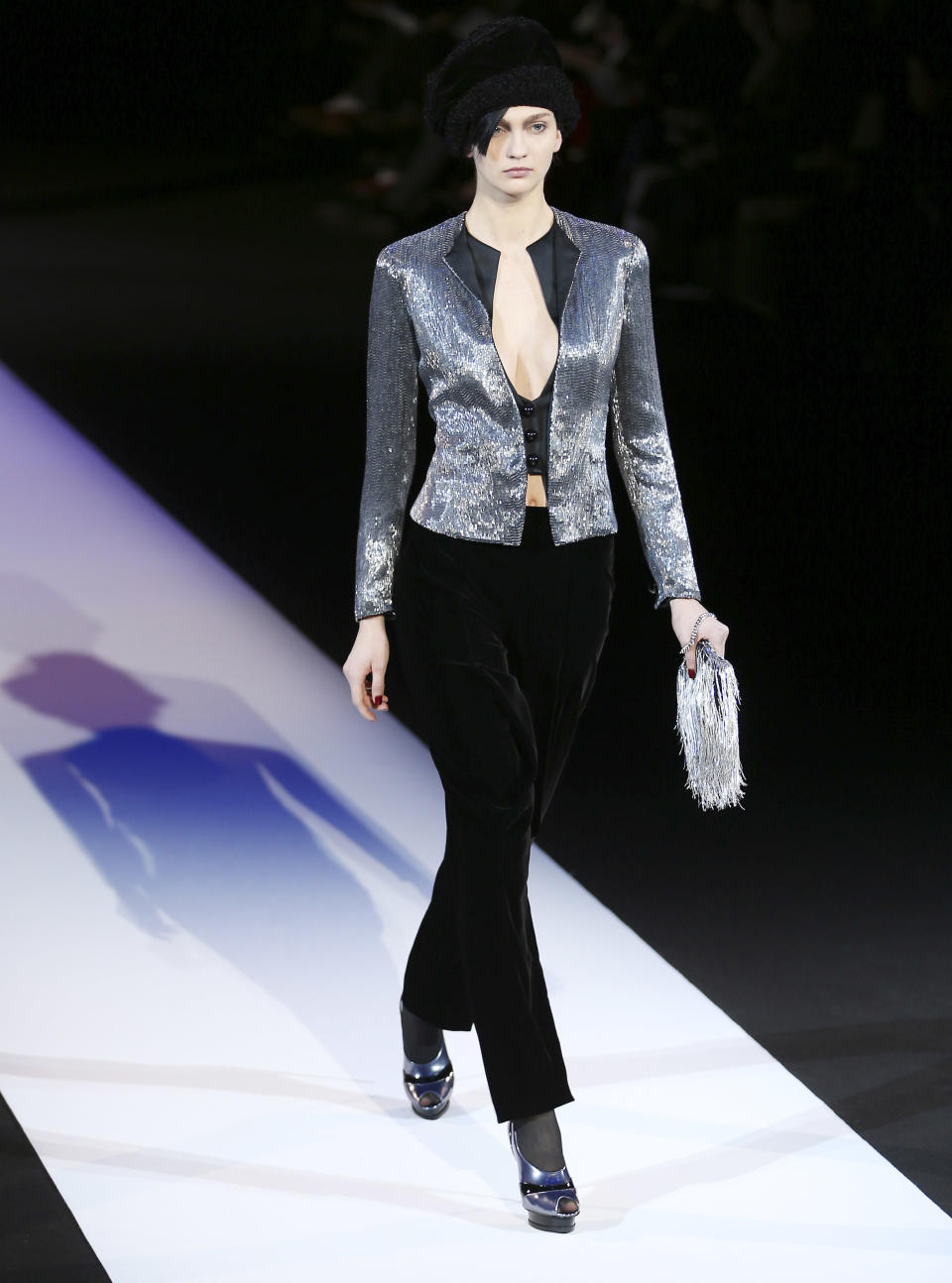 A model wears a creation for Giorgio Armani women's Fall-Winter 2013-14 collection, part of the Milan Fashion Week, unveiled in Milan, Italy, Monday, Feb. 25, 2013. (AP Photo/Antonio Calanni)