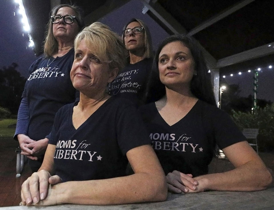 FILE - Moms for Liberty members, from left, Cheryl Bryant, Mishelle Minella, Kelly Shilson and Jessica Tillmann pose for a portrait at Reiter Park on Thursday, Nov. 18, 2021 in Longwood, Fla. Tillmann is the chair of the group's Seminole County chapter. (Chasity Maynard/Orlando Sentinel via AP, File)