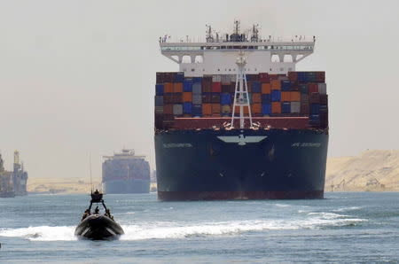A cargo ship is seen crossing through the New Suez Canal, Ismailia, Egypt, July 25, 2015. REUTERS/Stringer