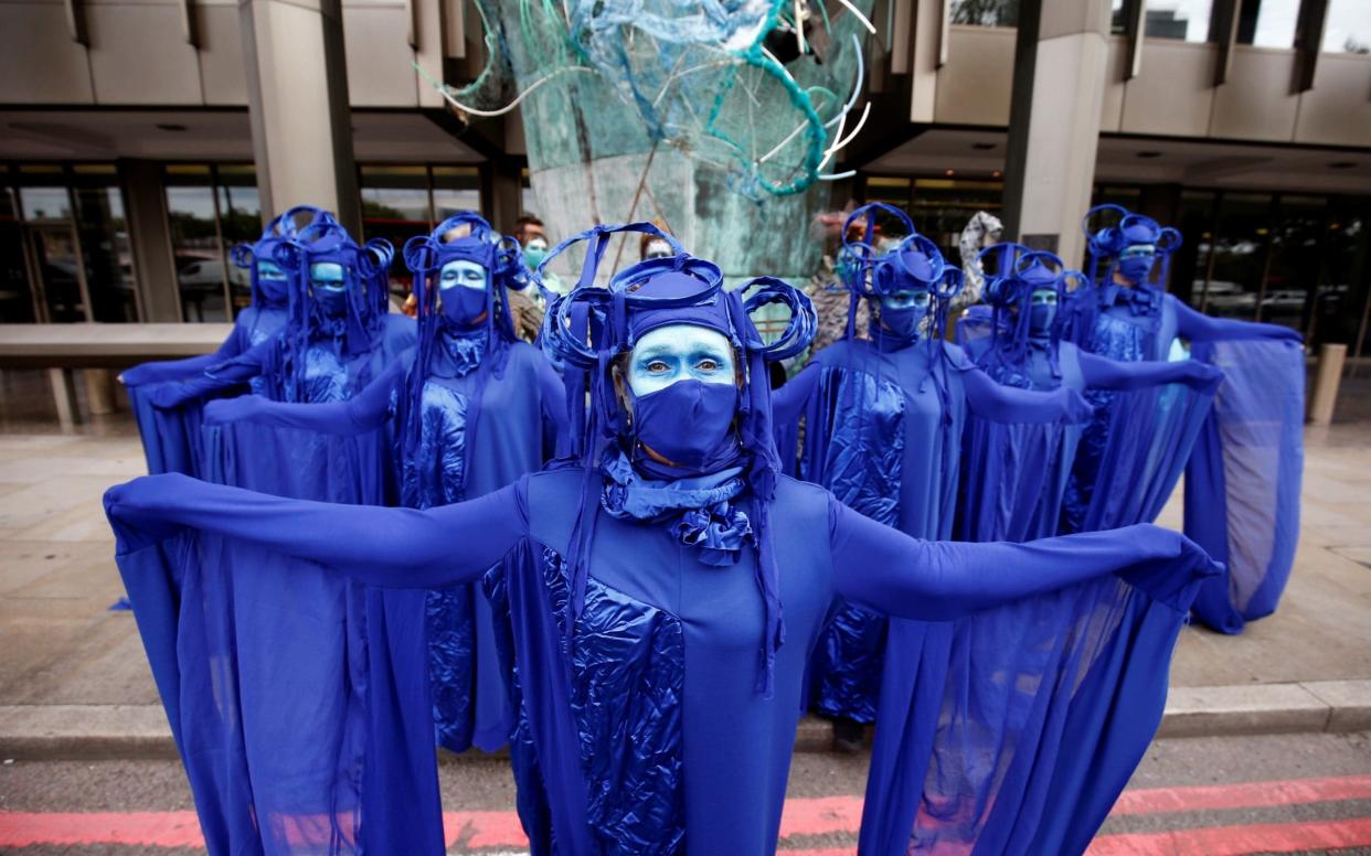 Members of the Ocean Rebellion group attend an Extinction Rebellion protest in London yesterday - Henry Nicholls/Reuters