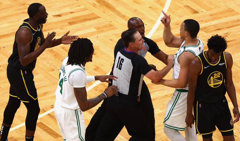 BOSTON, MASSACHUSETTS - JUNE 08: Grant Williams #12 of the Boston Celtics and Draymond Green #23 of the Golden State Warriors argue in the second quarter during Game Three of the 2022 NBA Finals at TD Garden on June 08, 2022 in Boston, Massachusetts. NOTE TO USER: User expressly acknowledges and agrees that, by downloading and/or using this photograph, User is consenting to the terms and conditions of the Getty Images License Agreement. (Photo by Elsa/Getty Images)