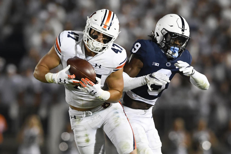 Auburn tight end John Samuel Shenker (47) catches a pass in front of Penn State cornerback Joey Porter Jr. (9) during an NCAA college football game in State College, Pa., on Saturday, Sept. 18, 2021. (AP Photo/Barry Reeger)