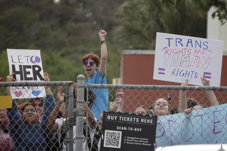 FILE - Students from Monarch High School in Coconut Creek, Fla., walk out of the school building Nov. 28, 2023, in support of a transgender student who plays on the girls volleyball team. A new federal regulation protecting the rights of transgender students has prompted lawsuits from GOP states that say it would require them to allow transgender athletes to compete on school teams. (Joe Cavaretta/South Florida Sun-Sentinel via AP, File)