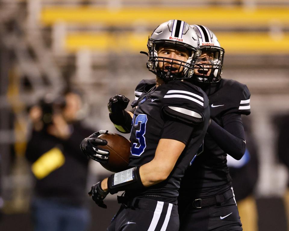 Hilliard Bradley’s Denis Shishlo (13) celebrates a touchdown during the Jaguars' 35-28, double-overtime win over Upper Arlington in the Division I, Region 3 final at Historic Crew Stadium.