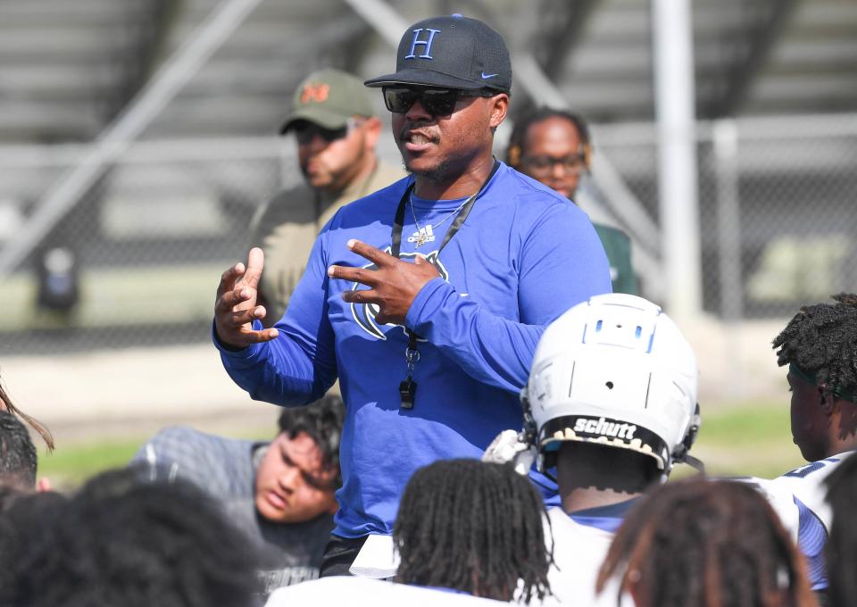 Heritage High football head coach Mykel Benson talks to his players during spring practice Friday, May 5, 2023. Craig Bailey/FLORIDA TODAY via USA TODAY NETWORK