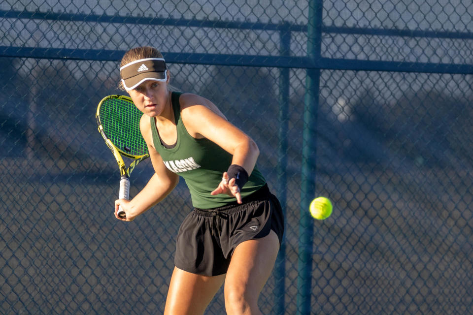 Emma Wagner of Mason High School strikes the ball in her first set at Flight A of the Greater Cincinnati Tennis Coaches Association's Coaches Classic Sept. 23, 2023.