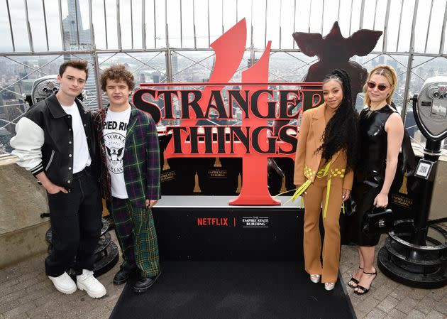 Actors Noah Schnapp, from left, Gaten Matarazzo, Priah Ferguson and Cara Buono pose on the 86th floor observatory at the Empire State Building in honor of the 