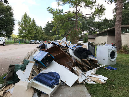 Rotting drywall and other material ripped out of homes damaged by Tropical Storm Harvey sits on the edge of a residential street in Houston's Meyerland neighborhood in Houston, Texas, U.S., September 4, 2017. REUTERS/Ernest Scheyder