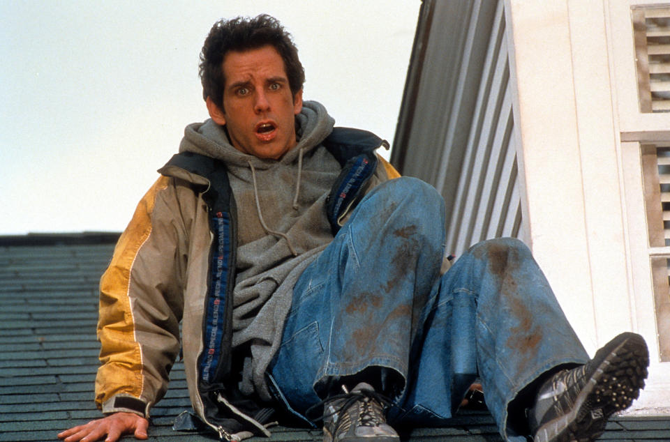 A dirtied Ben Stiller sitting on top of roof in a scene from the film 'Meet The Parents', 2000