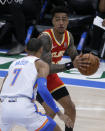 Atlanta Hawks forward John Collins (20) goes against Oklahoma City Thunder forward Darius Bazley (7) during the second half of an NBA basketball game, Friday, Feb. 26, 2021, in Oklahoma City. (AP Photo/Garett Fisbeck)