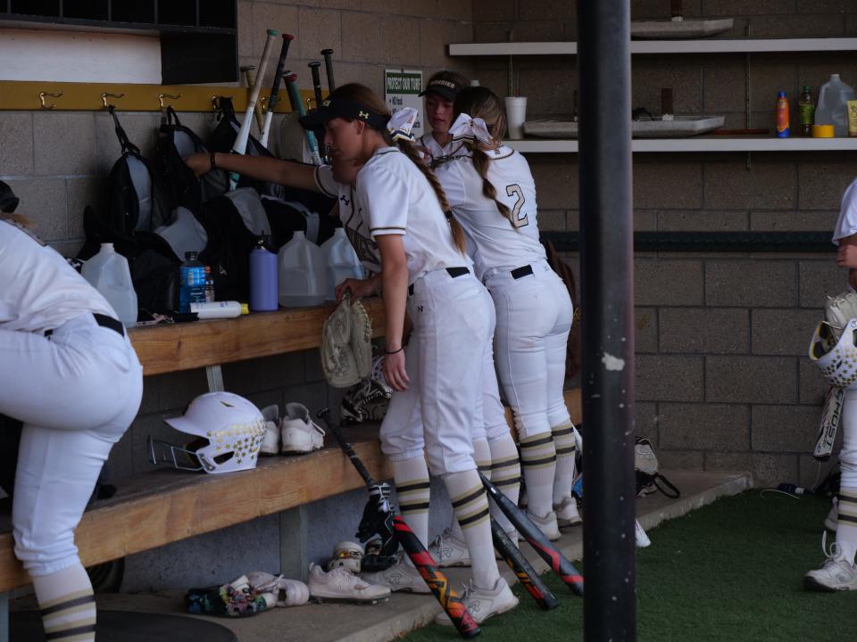 The Amarillo High softball team cleans up the dugout after beating Lubbock-Cooper on Friday, April 14, 2023 at Amarillo High.