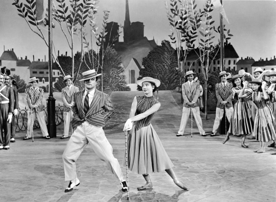 PHOTO: Gene Kelly dances next to Leslie Caron a in a still from the 1951 film 'An American In Paris.'  (MGM Studios/Getty Images, FILE)