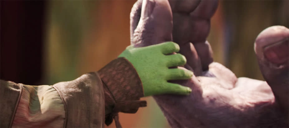 A closeup of Young Gamora (Ariana Greenblatt) and Thanos’ (Josh Brolin) Hands in <em>Avengers: Infinity War</em>