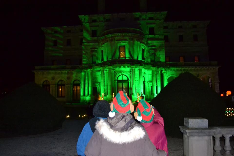 The Breakers is lit up in a festive green as part of the Sparkling Lights at the Breakers.