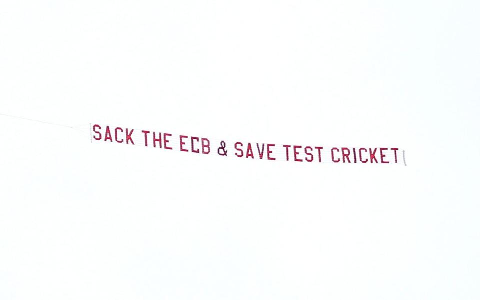 A plane with a banner reading 'Sack The ECB & Save Test Cricket' flies over Headingley - Nigel French/PA Wire
