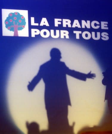 FILE PHOTO: French presidential candidate Jacques Chirac's shadow is projected under the sign of his campaign "F..