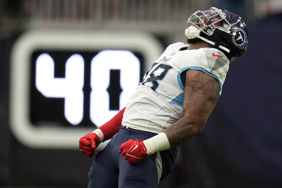 Tennessee Titans defensive tackle Jeffery Simmons celebrates after sacking Houston Texans quarterback Davis Mills for a 12-yard loss during the second half of an NFL football game Sunday, Oct. 30, 2022, in Houston. (AP Photo/Eric Christian Smith)