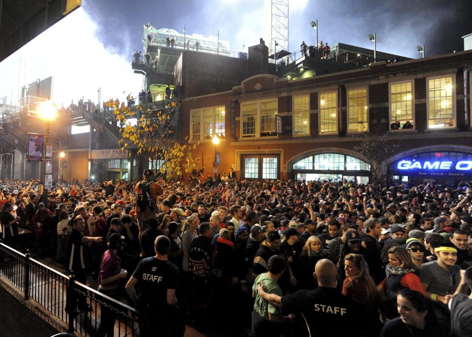 Fans gather after the Boston Red Sox won the MLB baseball's World Series at Landsdown Street near Fenway Park