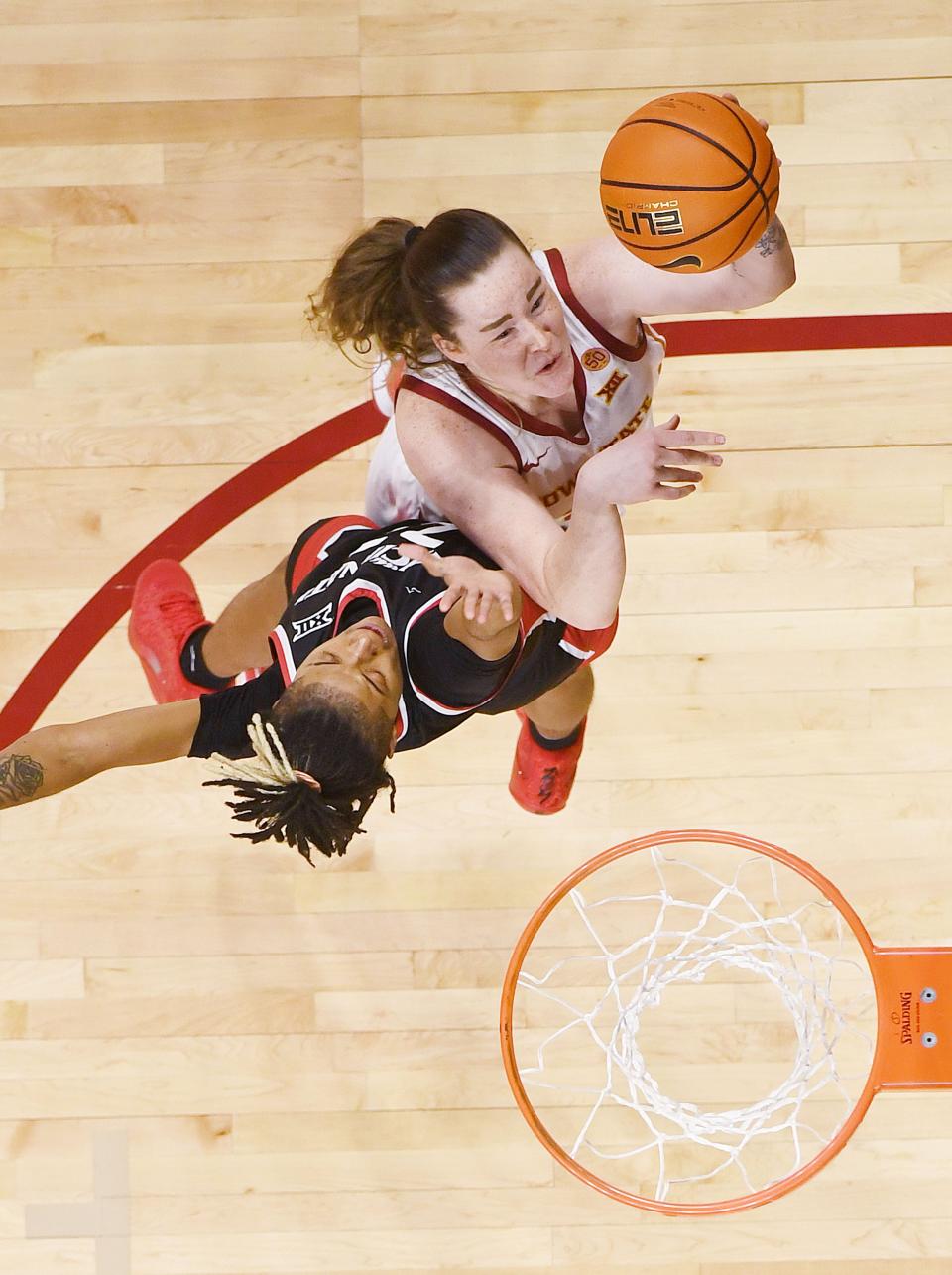 Iowa State's Addy Brown, top, takes a shot over a Cincinnati defender on March 2.