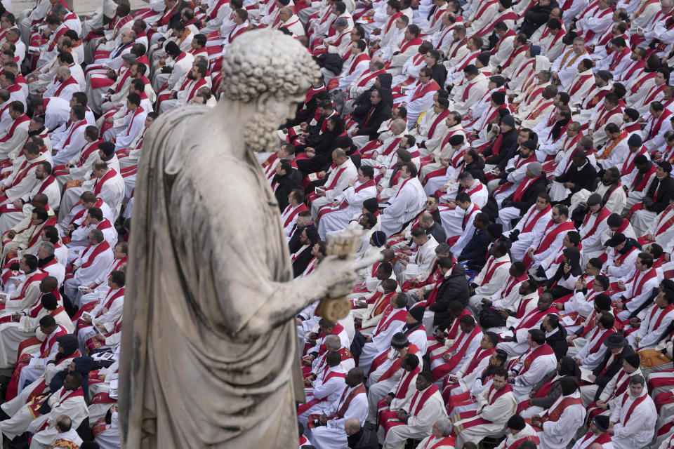 Faithful attend the funeral mass for late Pope Emeritus Benedict XVI in St. Peter's Square at the Vatican, Thursday, Jan. 5, 2023. Benedict died at 95 on Dec. 31 in the monastery on the Vatican grounds where he had spent nearly all of his decade in retirement. (AP Photo/Ben Curtis)