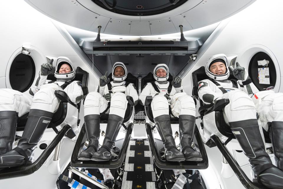 This undated photo made available by SpaceX in September 2020 shows, from left, NASA astronauts Shannon Walker, Victor Glover, commander Mike Hopkins and Japan Aerospace Exploration Agency astronaut Soichi Noguchi inside SpaceX's Crew Dragon spacecraft. The four are scheduled to be SpaceX’s second crew launch in mid-November 2020. (SpaceX via AP) ORG XMIT: NY561