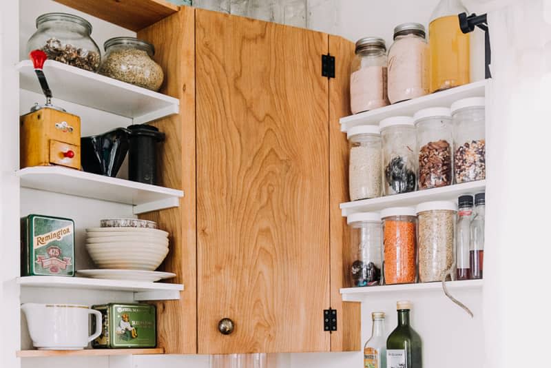 Kitchen cabinet and shelves with organized canisters