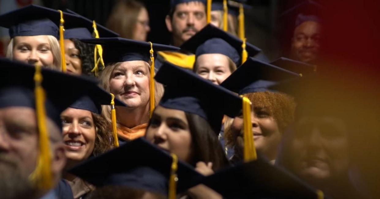 Students receiving their master's degrees at Western Governors University Ohio file into their spring commencement in this April 2019 file photo.