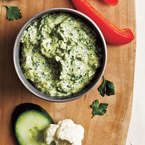 We use watercress as the base green in this dip because we like it's slightly peppery flavor, but you can use spinach, kale, or even mustard greens if you prefer. A touch of anchovy paste in the mix won't make the dip taste fishy. Rather, it lends meaty umami flavor as a bottom note to the blend. If you don't have anchovy paste, an equal amount of fish sauce would work. it makes a great last-minute party snack since it's made up mostly of kitchen staples. Serve with crackers or crudité. The dip also makes a creamy, delicious sandwich spread. <p><a rel="nofollow noopener" href="http://www.myrecipes.com/recipe/zesty-green-goddess-dip" target="_blank" data-ylk="slk:View Recipe: Zesty Green Goddess Dip;elm:context_link;itc:0;sec:content-canvas" class="link ">View Recipe: Zesty Green Goddess Dip</a></p>