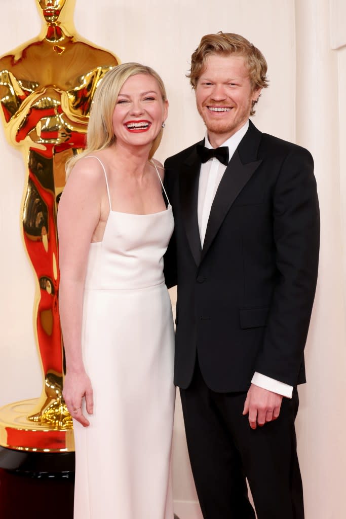 Kirsten Dunst nearly ate the red carpet during the Oscars 2024 on Sunday while attempting to pose for a picture with her husband, Jesse Plemons. Mike Coppola/Getty Images