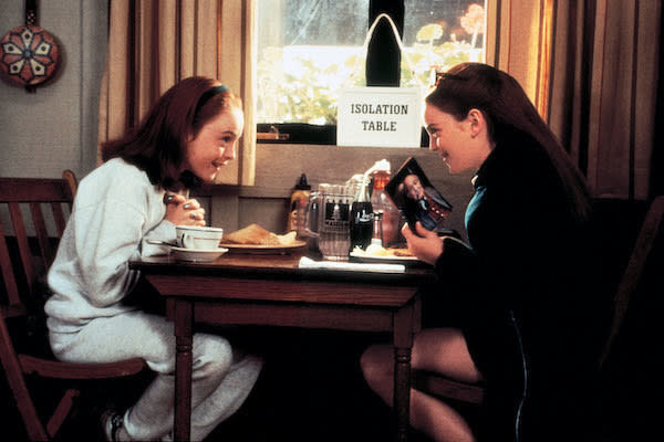 Lindsay Lohan talking with Lindsay Lohan at a table