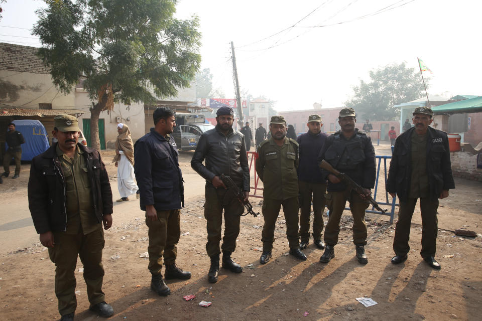 Pakistani police officers stand guard outside Multan jail after a court's decision for a professor facing blasphemy case, in Multan, Pakistan, Saturday, Dec. 21, 2019. A Pakistani court on Saturday convicted the Muslim professor of blasphemy, sentencing him to death for allegedly spreading anti-Islamic ideas. Junaid Hafeez has been held for six years awaiting trial. He's spent most of that time in solitary confinement because he would likely be killed if left with the general population, local media have reported. (AP Photo/Asim Tanveer)