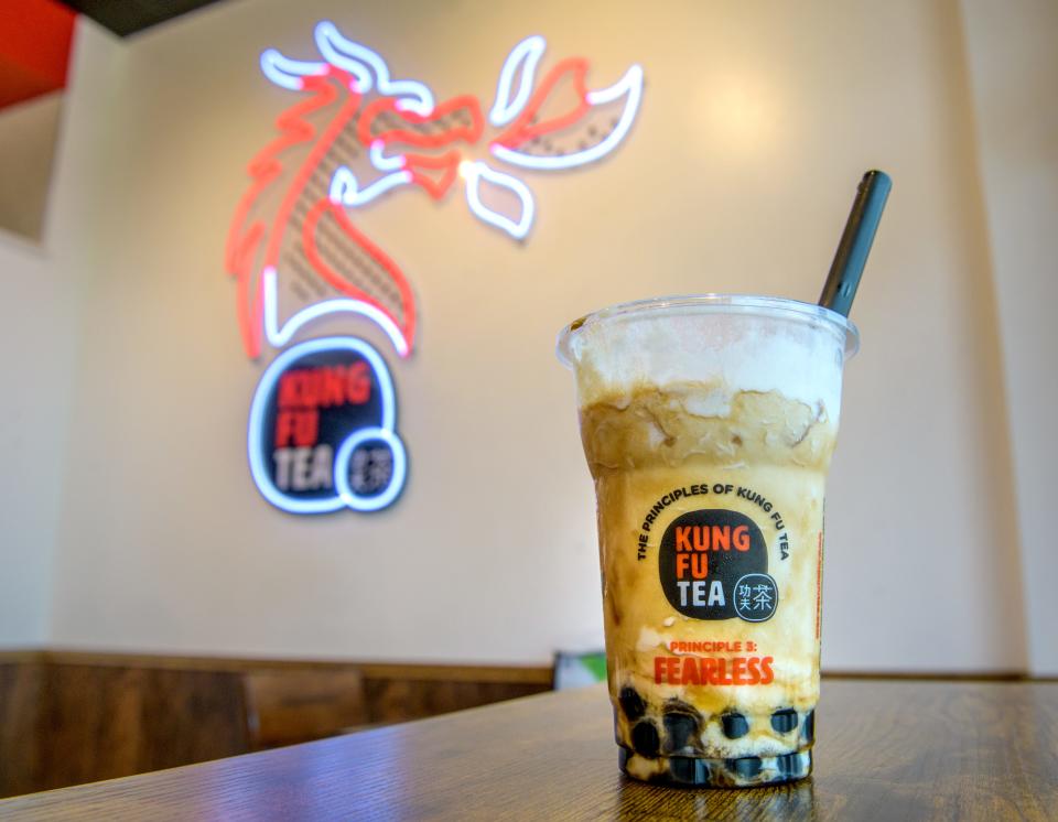 A freshly-made coconut milk tea with bubbles sits on a table at the new business in East Peoria's Levee District.