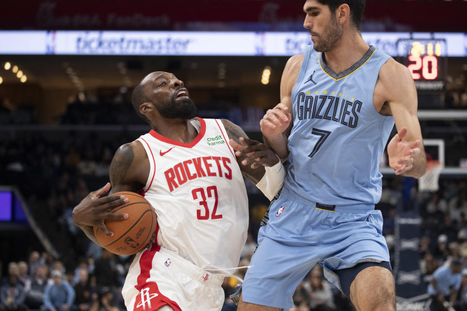 Houston Rockets forward Jeff Green (32) works against Memphis Grizzlies forward Santi Aldama (7) during the first half of an NBA basketball game Friday, Dec. 15, 2023, in Memphis, Tenn. (AP Photo/Nikki Boertman)