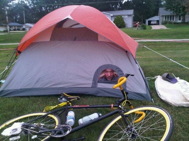 Joey Flaphole earns the nickname, peeking through an odd feature of his tent during RAGBRAI in 2011.