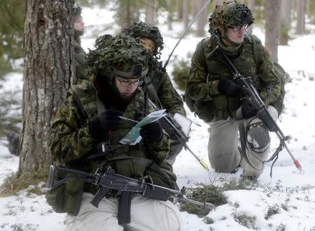 An Estonian army conscript soldiers attend a tactical training in the military training field near Tapa, Estonia February 16, 2017. Picture taken February 16, 2017. REUTERS/Ints Kalnins