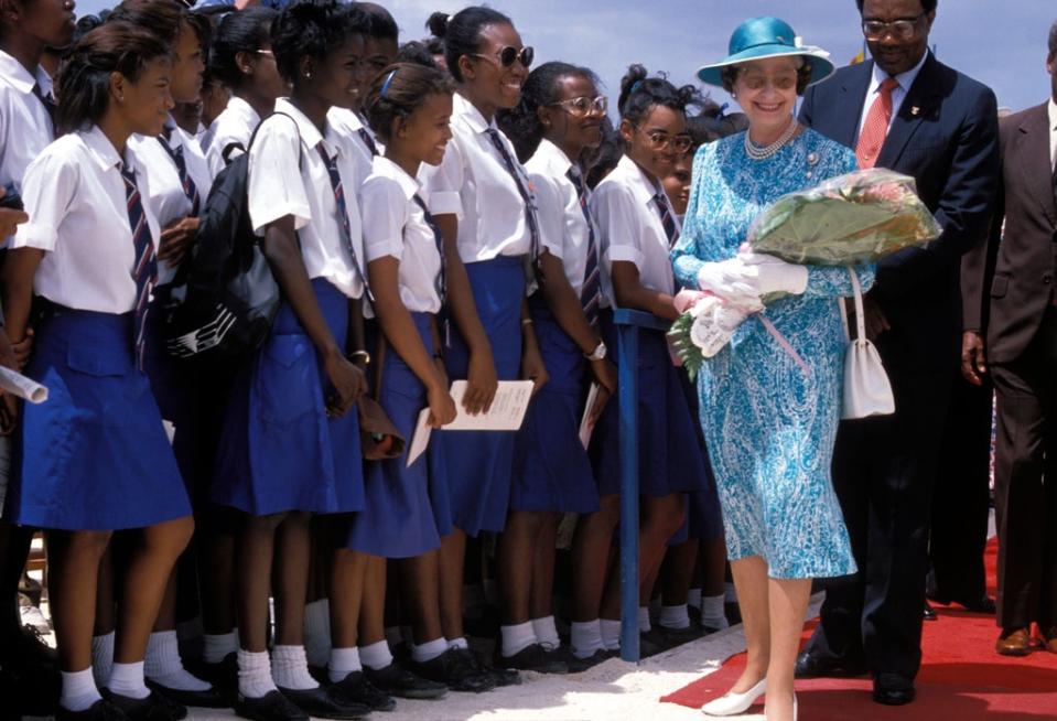 Queen Elizabeth II visit to Queen’s College to officiate at a stone laying ceremony for the new Barbados school building in 1989 (Alamy)