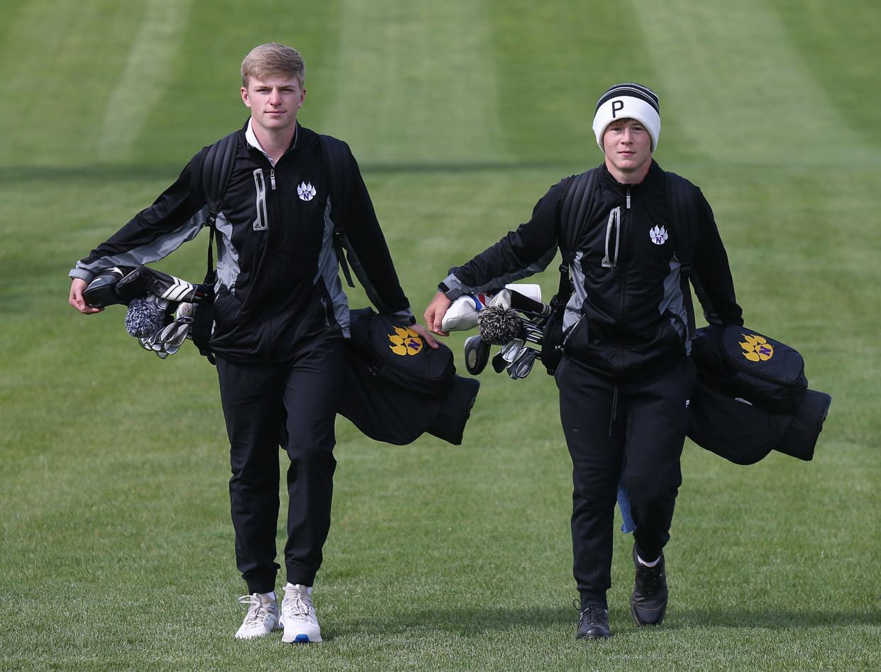 Senior Kyle Kingsbury (left) and freshman Parker Rodgers hope to help the Nevada boys golf team qualify for state for the first time since winning the 3A state championship in 2019.