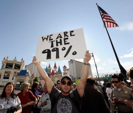 A protester affiliated with the Occupy Las Vegas movement, marches on the Las Vegas Strip October 6, 2011 in Las Vegas, Nevada. The protest is one of many around the country held in solidarity with the Occupy Wall Street protests currently taking place in New York City