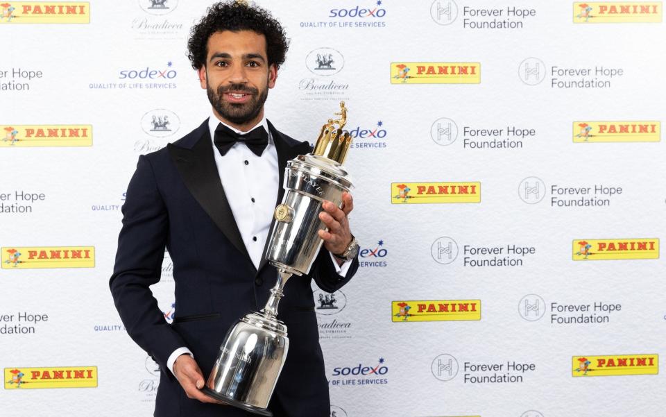 Mohamed Salah shows off his trophy after being named PFA Player of the Year on Sunday night   - PA