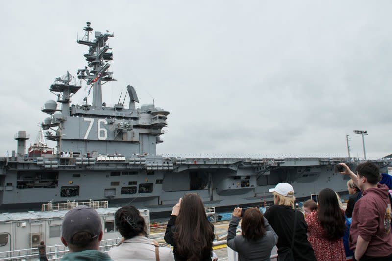 Families of the crew of the U.S. Navy aircraft carrier USS Ronald Reagan see off the ship at Fleet Activities Yokosuka in Kanagawa-Prefecture, Japan on Thursday. Photo by Keizo Mori/UPI