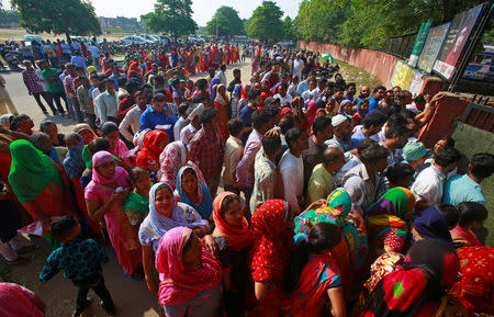 Voters stand in queues as they wait to cast their vote outside a polling station during the final phase of general election in Chandigarh, India, May 19, 2019. REUTERS/Ajay Verma