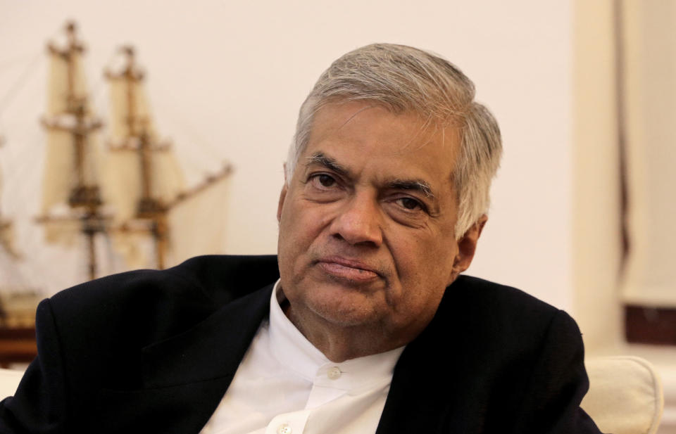 FILE -In this Friday, Nov. 2, 2018, file photo, ousted Sri Lankan Prime Minister Ranil Wickremesinghe listens during an interview with the Associated Press at his official residence in Colombo, Sri Lanka. (AP Photo/Eranga Jayawardena, File)