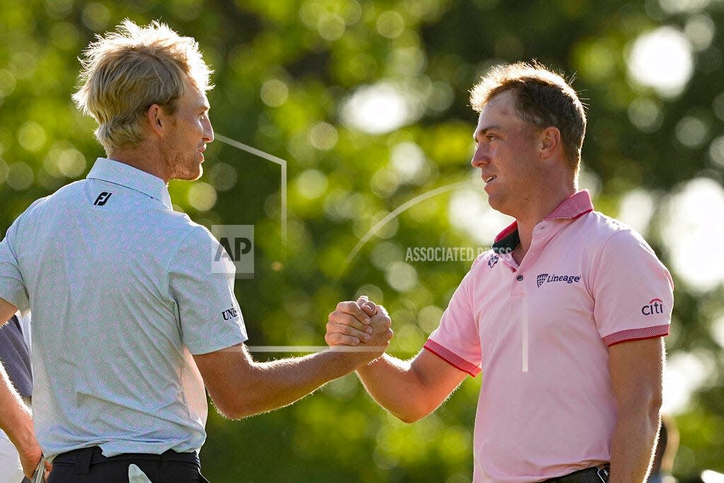Justin Thomas is greeted by Will Zalatoris after winning the PGA Championship golf tournament in a playoff over Zalatoris at Southern Hills Country Club, Sunday. Both players will compete in the Charles Schwab Challenge beginning Thursday in Fort Worth, Texas.