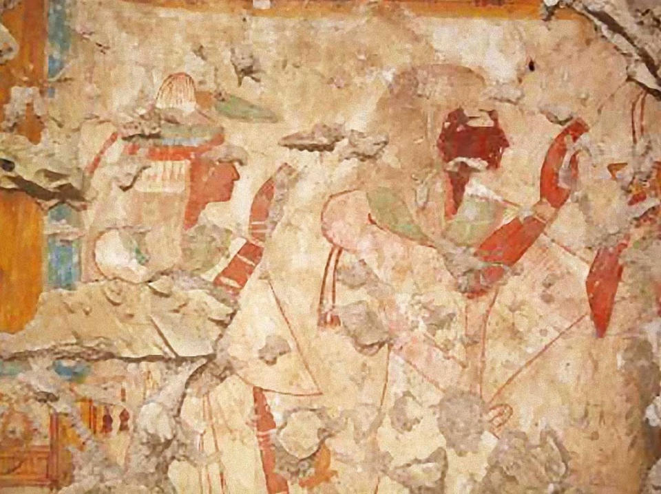 Here, a painting on a tomb wall showing Khonsu and his wife worshipping the gods Osiris and Isis. <cite>Waseda University</cite>